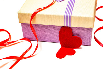 Preparing a Valentine's Day gift with red hearts.