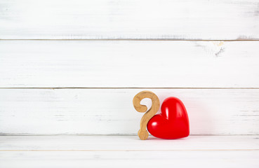 Red Heart Shaped with Question Mark over white wood background. Symbol for love problem concept with copy space.