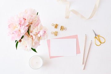 Mockup wedding invitation and envelope with pink peonies on a white background