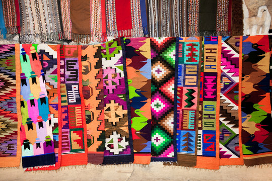 Peruvian traditional colourful native handicraft textile fabric at market in Machu Picchu,  Peru,