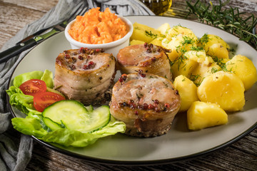 Pork tenderloin wrapped in bacon.