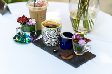 Coffee set on white table.