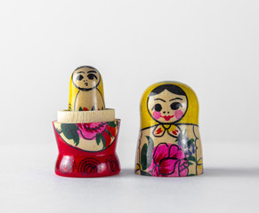 An open Russian traditional Russian doll toy inside which is another Russian doll, on a white...