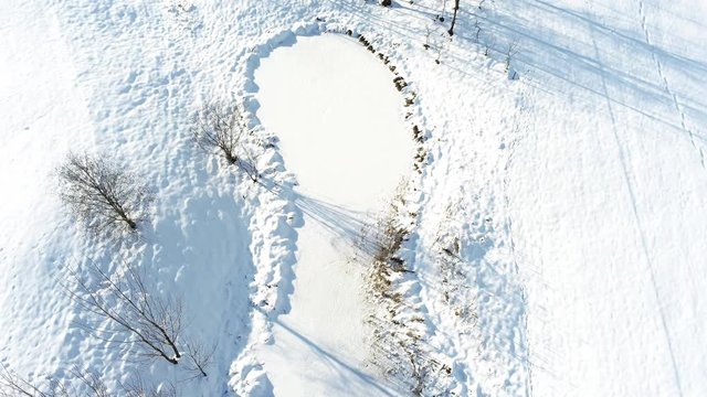 Aerial drone fly over frozen lake 
