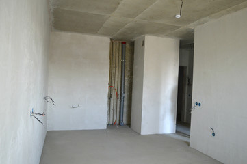 Apartment building under construction, apartment designed by the developer, plaster screed.