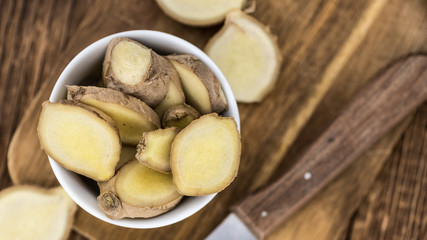 Portion of fresh Ginger (selective focus; close-up shot)