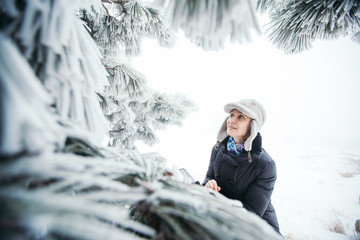 Woman in winter forest.
