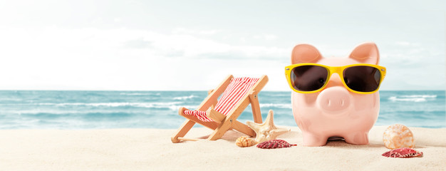 Piggy bank on vacation. Finance and travel concept