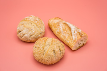 Baguette isolated on pink background. 