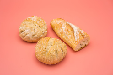 Baguette isolated on pink background. 