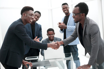 reliable handshake of business partners over the desktop.