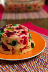 Gelatin in colors, sweet very famous in Brazil. Brazilian candy on the wood table kitchen