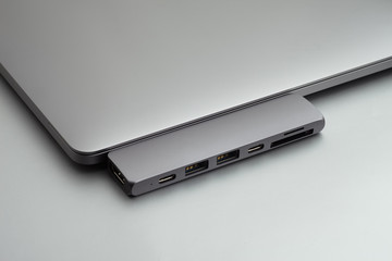 Space grey laptop with usb hub