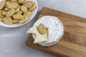  blue cheese lies on a wooden board