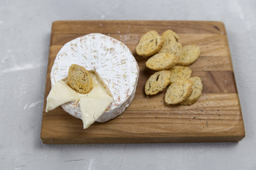 blue cheese lies on a wooden board