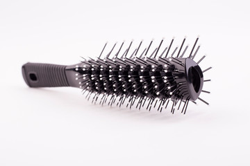 Black plastic comb isolated on white background