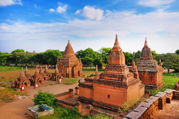 Fototapeta na wymiar Blue sky above temples surrounded by green vegetation in old Bagan, Myanmar.