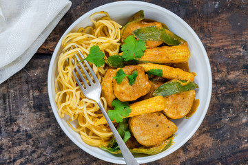 Satay pork curry with egg noodles - overhead view