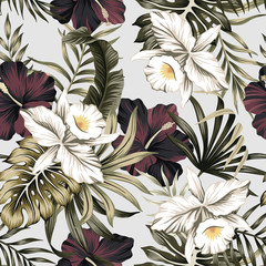 Tropical vintage white orchid, purple hibiscus flower, palm leaves floral seamless pattern grey background. Exotic jungle wallpaper.