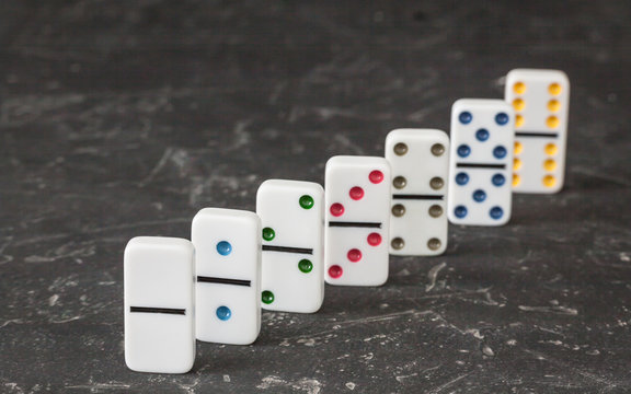 Black Dominoes game block on a colored background Stock Photo - Alamy