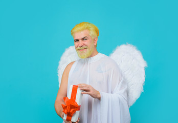 February 14. Cupid with gift. Love concept. Cupid with gift box. Valentine angel. Cupid angel with...