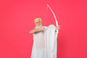 Valentines Day concept. Arrow of love. Cupid throws love arrow with bow for valentine day. Male...