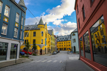Naklejka na ściany i meble Colorful art nouveau buildings in downtown Alesund Norway