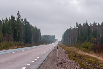 asphalt, foggy, straight road in central sweden