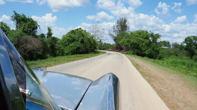 Vintage car on the countryside road near Bayamo, Granma Province, Cuba