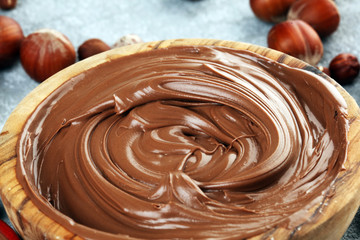 Homemade hazelnut spread in wooden bowl. Hazelnut Nougat cream with hazelnuts