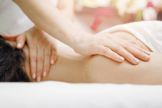 Massage of neck for woman in salon beauty spa