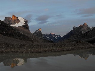 Evening twilight and the natural reflection, at Summit Lake Auyuittuq National park