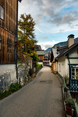 Fototapeta na wymiar Narrow street in Hallstatt village next to Hallstatter lake in Austrian Alps, Austria
