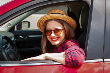 Young woman driving a modern car