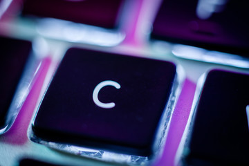 C key on computer keyboard close up