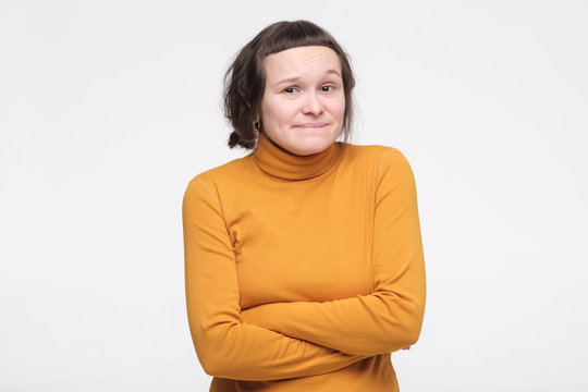 student feeling awkward with weird smile after making mistake and being guilty