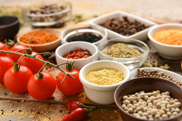 Different spices on wooden table