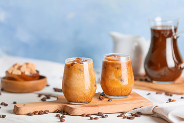 Glasses of tasty cold coffee on table