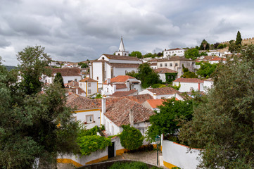 Panorama of Obidos village, with evidence of the white color of the houses and the orange of their roofs.