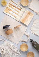 Zero waste kit. Set of eco friendly bamboo cutlery, mesh cotton bag, reusable coffee tumbler and water bottle. Sustainable, ethical, plastic free lifestyle.