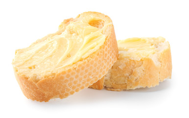 Slices of bread with butter on white background