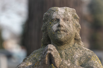 Fototapeta na wymiar Beautiful Vintage Sculpture at old Catholic cemetery.