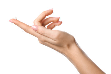 Hand of young woman with cosmetic cream on white background