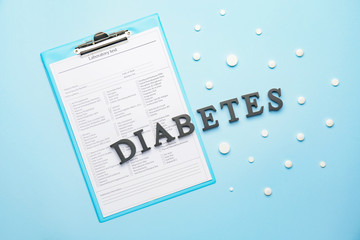 Composition with word DIABETES on color background