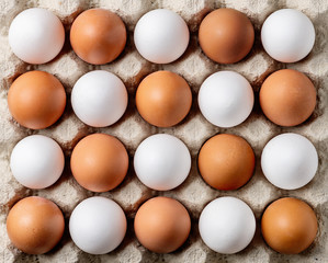 Carton of fresh brown and white eggs