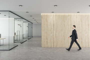 Businessman walking in modern office