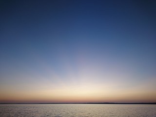 Clear sky, evening sunset on a lake in Karelia.