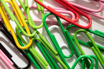 plastic paper clips on table close-up