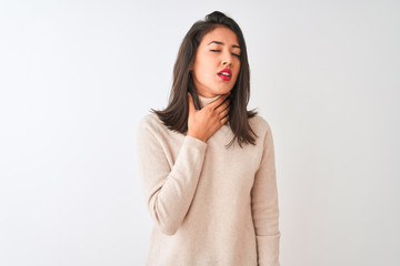 Fototapeta premium Beautiful chinese woman wearing turtleneck sweater standing over isolated white background Touching painful neck, sore throat for flu, clod and infection