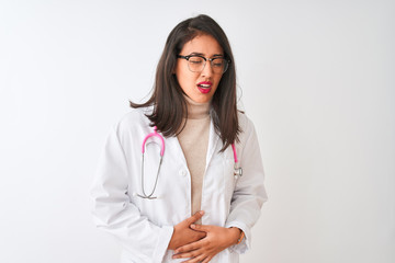 Chinese doctor woman wearing coat and pink stethoscope over isolated white background with hand on stomach because indigestion, painful illness feeling unwell. Ache concept.